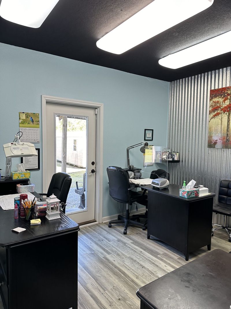 Aesthetician room with desk and treatment chair